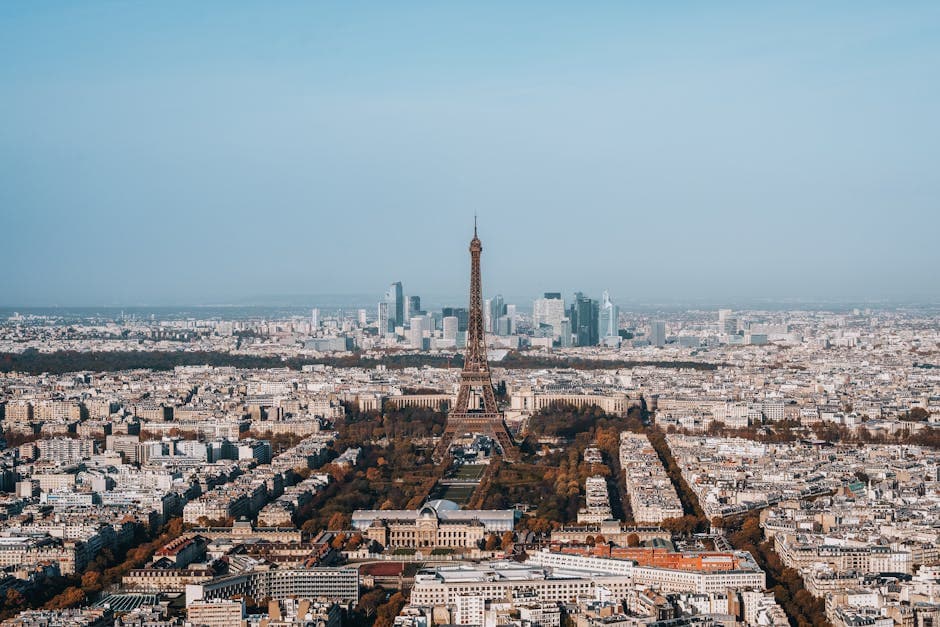 Breathtaking aerial view of Paris with Eiffel Tower, capturing iconic cityscape.
