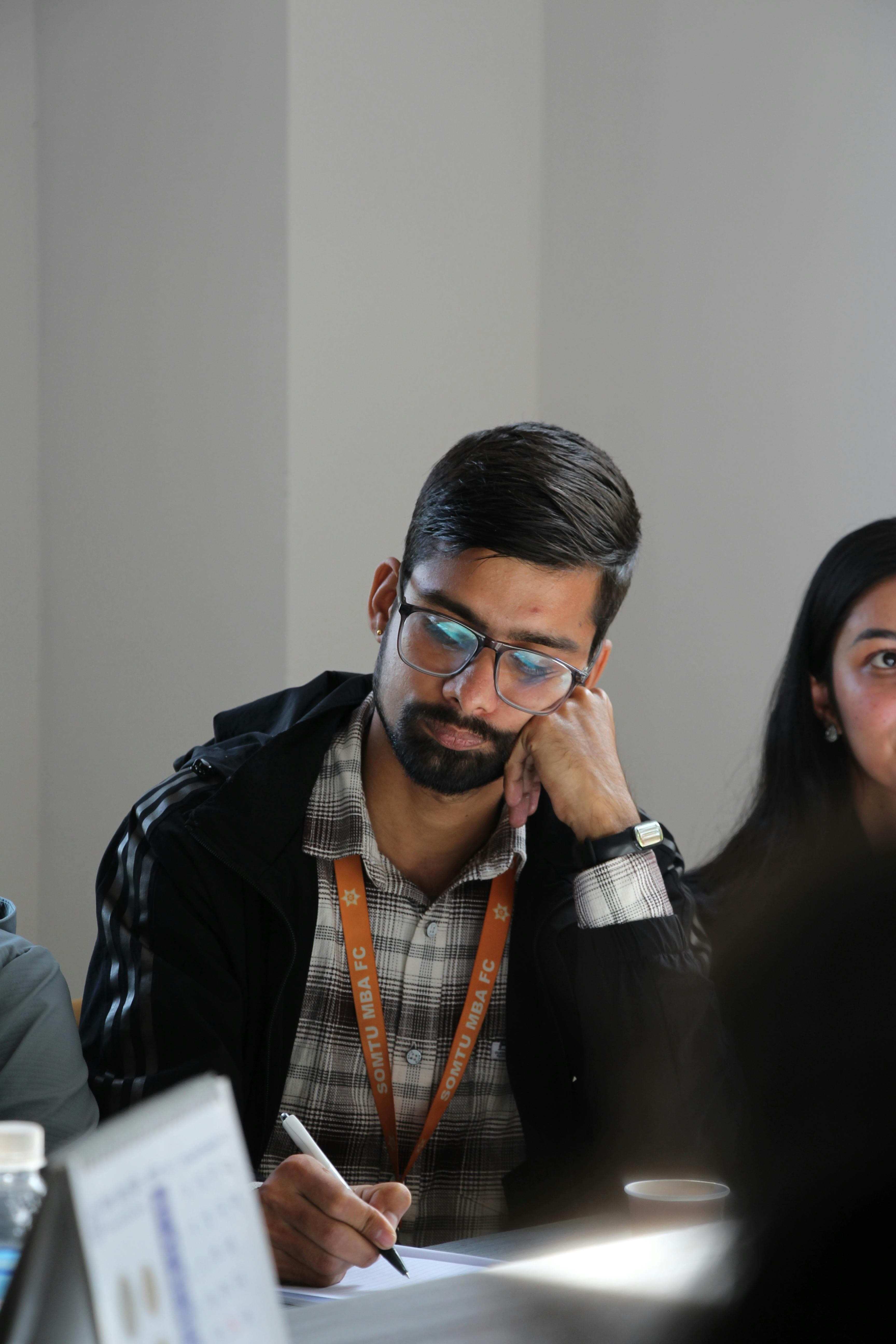 University students attentively taking part in a seminar discussion.